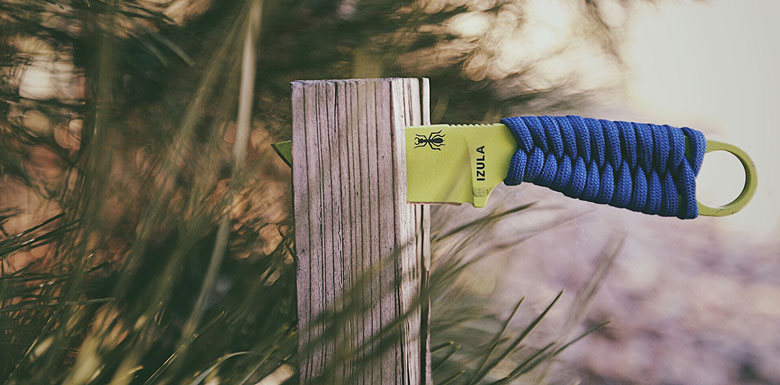 The ESEE Izula Neck Knife, with paracord wrap.