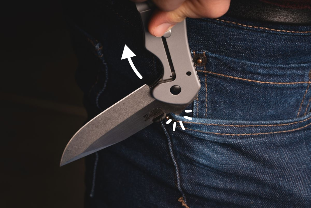 A man using the Wave opener on a Kershaw Emerson CQC-6K, catching it on his pocket as he draws it from his pocket.