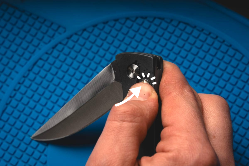 A man pressing the button on an automatic Pro-Tech Brend.