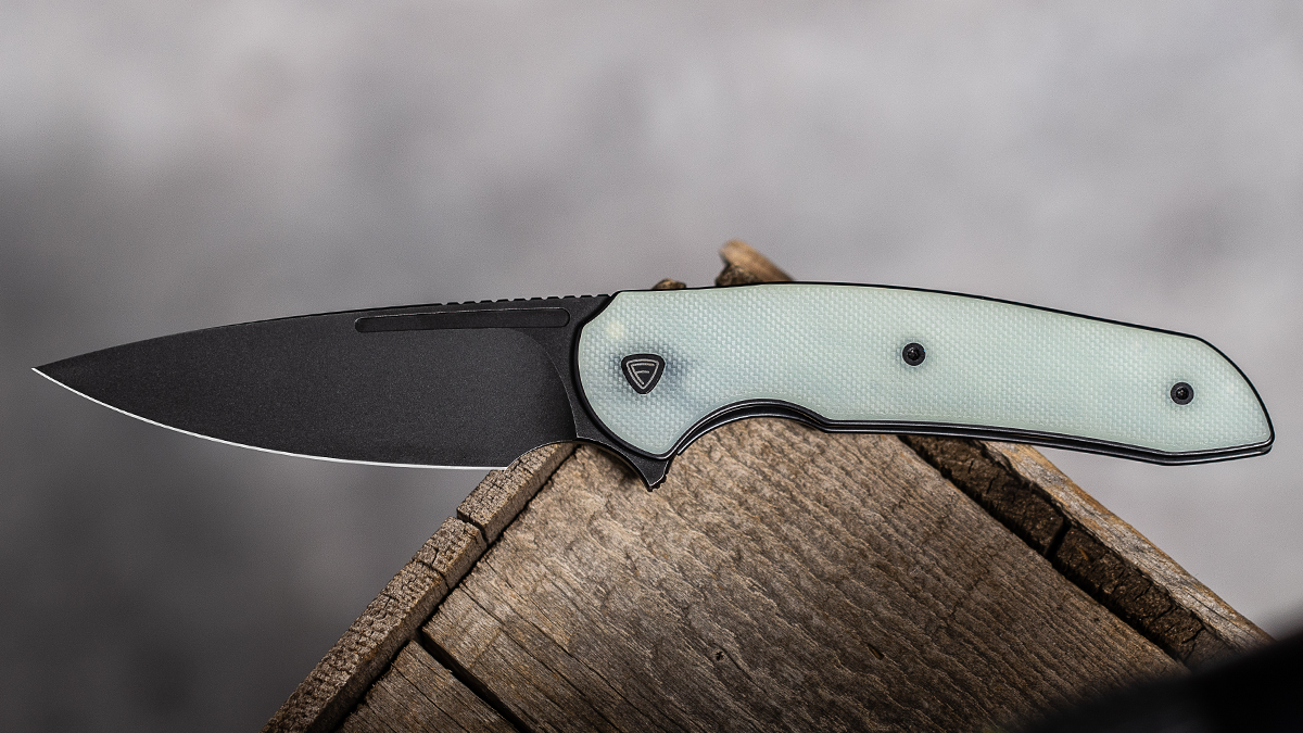 Open Ferrum Forge Stinger with a black blade and a jade G-10 handle