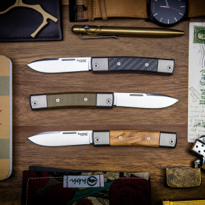 LionSteel BestMan flat lay knives with wood background
