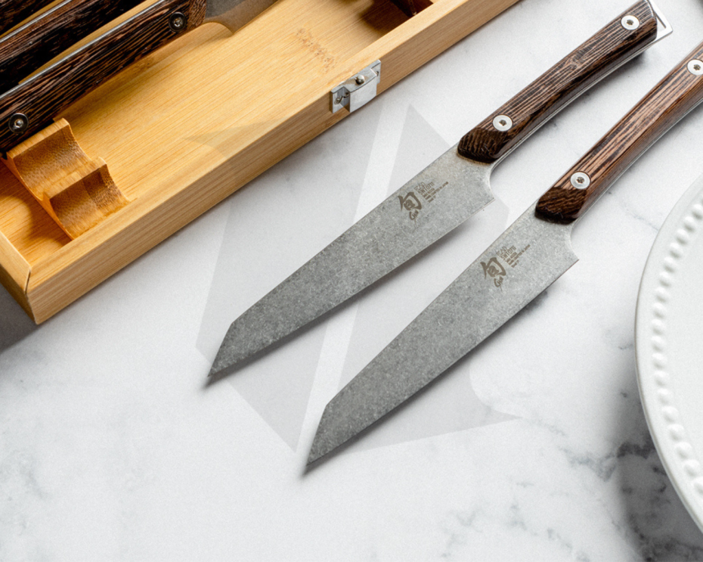 Shun Kitchen knives on a marble counter.