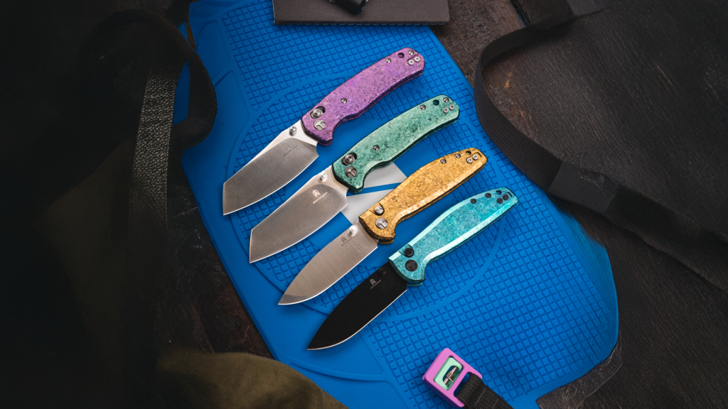 four colorful Bestech knives on a blue background