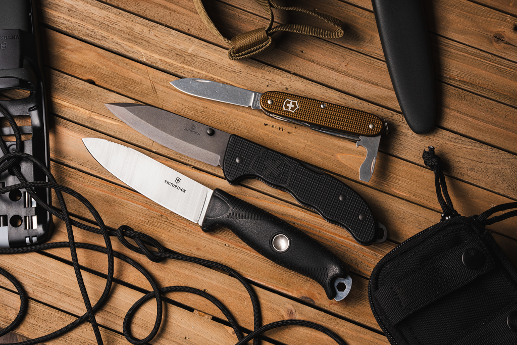 The Victorinox Venture Pro, Evoke, And Limited Edition Alox scales pocket knife.