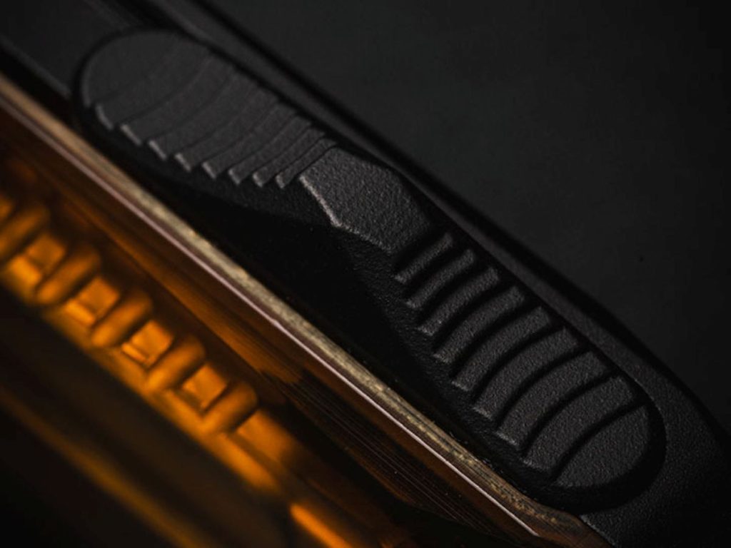 A detailed closeup of the thumb slide texturing.