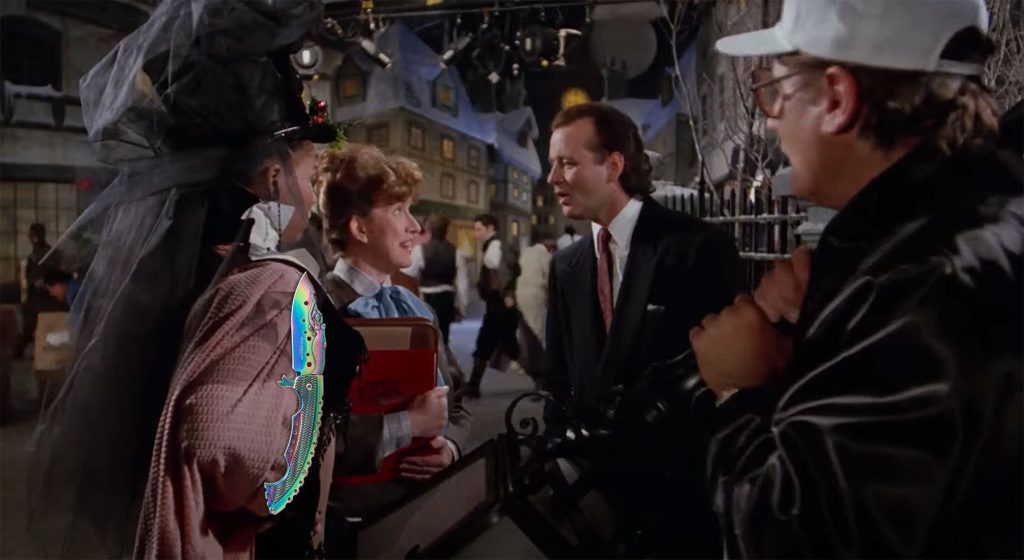 A still image from the movie Scrooged showing a scene where a TV censor objects to inappropriate content.