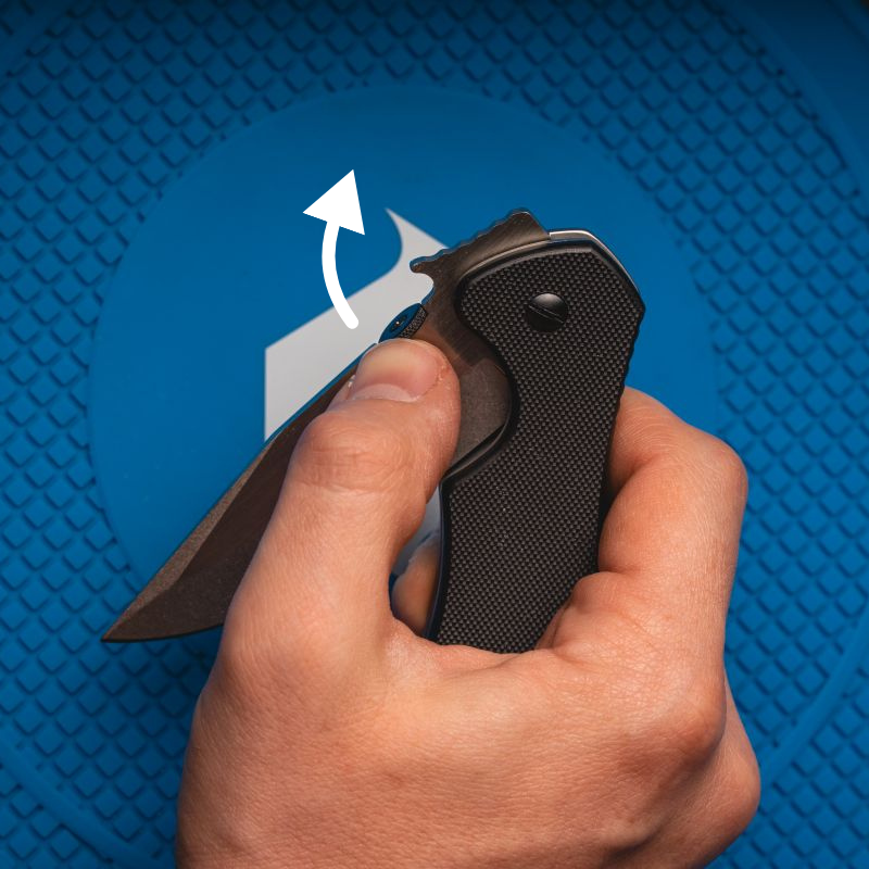 A man using the thumb disk opener on a Kershaw Emerson knife.