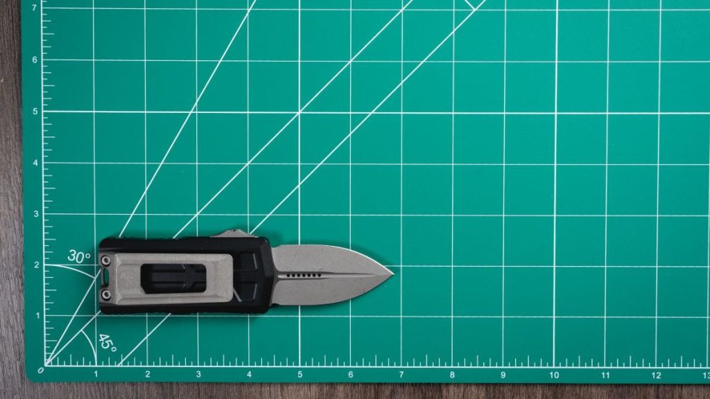 Microtech Exocet II on green mat